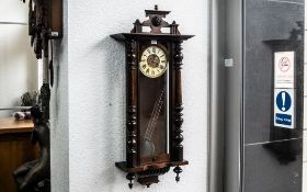 Vienna Wall Clock with glazed front and sides, cream chapter dial with Roman numerals, pendulum