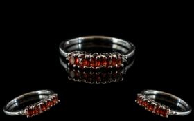 Sunset Orange Sapphire and Diamond Ring, five oval cut sunset sapphires in a row across the finger,