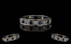 18ct White Gold Diamond and Sapphire Half Eternity Ring set with alternating round brilliant cut