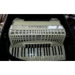 Cintage Corelli Universal Piano Accordion, cream colour, in fitted case. Measures 21" x 21".