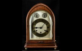 A Gustav Becker Mahogany Mantle Clock gilt chapter dial with Roman Numerals on a silvered dial.