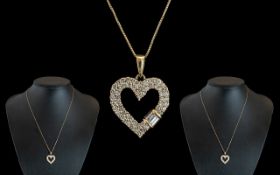14ct Gold - Diamond Set Heart Shaped Pendant - Attached to a 14ct Gold Chain.