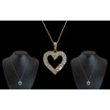 14ct Gold - Diamond Set Heart Shaped Pendant - Attached to a 14ct Gold Chain.