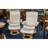 Pair of Cream Leather Stressless Chairs, with matching foot stools, on light wood circular bases.