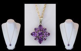 Ladies Attractive 9ct Gold Amethyst Set Pendant / Drop Attached to a 9ct Gold Chain.