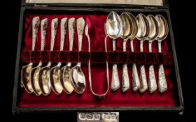 Edwardian Period Boxed Set of 12 Sterling Silver Teaspoons and Matching Sugar Tongs.