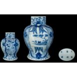 A 19th Century Chinese Blue and White Baluster Vase.