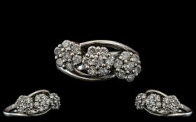 Ladies 18ct White Gold Attractive Triple Cluster Diamond Set Ring, the diamonds being well