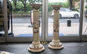 Pair of Tall Ceramic Jardinieres, decorated with gilt highlights and figures and cherubs.
