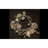 A Vintage - Sterling Silver Charm Bracelet - Loaded with 18 Silver Charms. All Marked for Silver.
