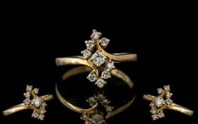 14ct Gold Diamond Set Dress Ring, set with a central round cut diamond and eight further diamonds.