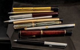 Collection of Vintage Pens, comprising a Waterman gold tone fountain pen, a red fountain pen, a
