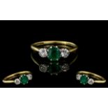 Ladies 18ct Gold and Platinum 3 Stone Diamond and Emerald Set Ring. Marked 18ct and Platinum to
