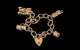 Ladies 9ct Gold Charm Bracelet With 4 Gold Charms - And Heart Shaped Gold Clasp and Safety Chain.