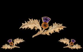 9ct Gold Thistle Brooch, set with topaz and amethyst. Fully hallmarked. Length 38 ml.