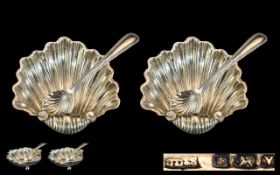 A Fine Pair of Victorian Period Sterling Silver Salts with Spoons. Both of Shell Form, Each Raised