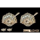 A Fine Pair of Victorian Period Sterling Silver Salts with Spoons. Both of Shell Form, Each Raised