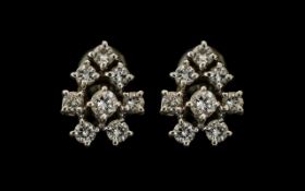 Pair of 18ct Gold Diamond Cluster Earrings, each set with 8 round brilliant cut diamonds, approx.