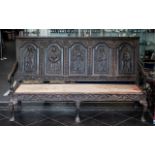 Carved Oak 17th Century Settle Bench, carved ecclesiastical panels, carving throughout depicting