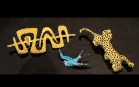 Three Pieces of Costume Jewellery to include a silver enamelled bird brooch, a gilt metal brooch