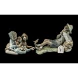 Two Lladro Figures, comprising a figure of a young child with a dog and puppies 'Playmates', No.