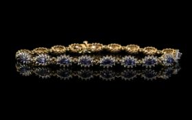 Ladies 9ct Gold Attractive Sapphire and Diamond Set Bracelet. Full Hallmark for 9.375. Set with 18