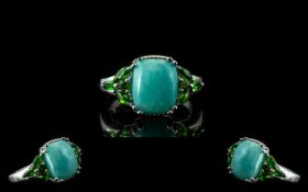Amazonite and Russian Chrome Diopside Ring, a 3.5ct cushion cut cabochon of Peruvian amazonite,