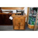 Vintage Gritzner Vintage German sewing machine housed in a wooden cabinet. Key's, Foot pedal,