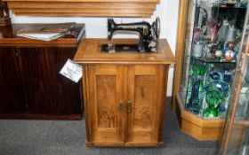 Vintage Gritzner Vintage German sewing machine housed in a wooden cabinet. Key's, Foot pedal,