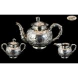 Chinese Export Three Piece Silver Tea Service With Embossed Floral Decoration And Bamboo Styled