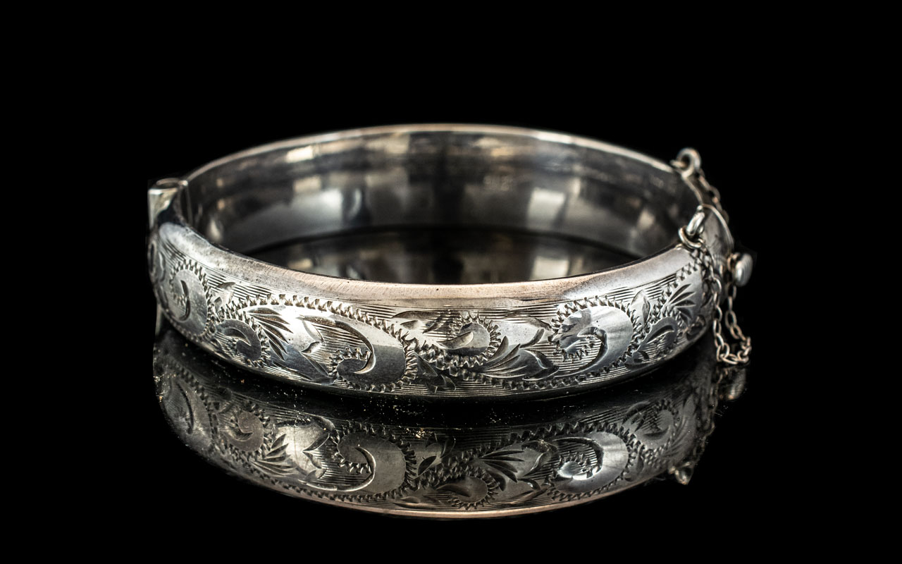 Sterling Silver Hinged Bangle, fully hallmarked, floral engraved decoration.
