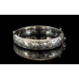 Sterling Silver Hinged Bangle, fully hallmarked, floral engraved decoration.