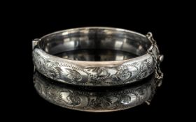 Sterling Silver Hinged Bangle, fully hallmarked, floral engraved decoration.