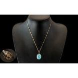 Yellow Metal Turquoise Coloured Pendant, suspended on a 9ct boxlink chain. Together with a 9ct