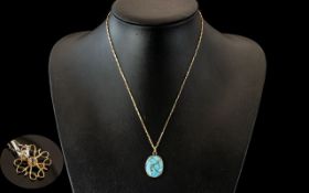Yellow Metal Turquoise Coloured Pendant, suspended on a 9ct boxlink chain. Together with a 9ct