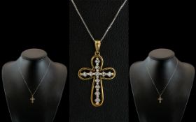9ct Gold Cross, set with princess cut diamonds, suspended on a fine white gold chin.