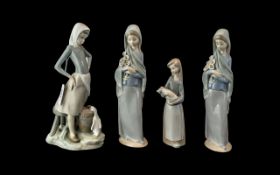 Four Lladro Figures, comprising two Lladro Porcelain Figurines No. 4650 'Girl with Calla Lillies'