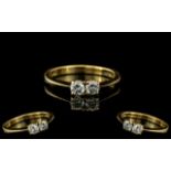 Ladies 18ct Gold Attractive Two Stone Diamond Set Ring. Full 18ct Hallmark to Interior of Shank. The