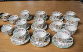 Minton Haddon Hall Tea Set, comprising 13 saucers, 13 cups, milk jug, sugar bowl and two small