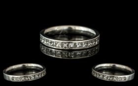 Platinum Half Eternity Ring, channel set with 12 princess cut diamonds, fully hallmarked. Ring