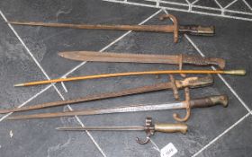 A Collection of Five Bayonets, to include a French, a spike bayonet, German Sawback Blade Bayonet.