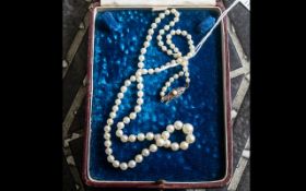 String of Cultured Pearls Necklace with Silver Clasp, Which Is Stamped Silver. Length 20 Inches.