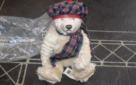 Steiff Teddy Bear, genuine mohair, No. 654459, with growler. Dressed in tartan tam o'shanter and