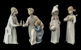 Four Lladro Figures, comprising 'Girl with Candle' No. 4868 8'' tall, Boy and Girl with Candle,