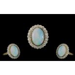 Ladies 9ct Gold - Large Opal and Diamond Set Ring. Fully Hallmarked for 9.375, The Large Oval Shaped