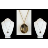 A Large 9ct Gold Smoky Topaz Set Pendant with Attached 9ct Gold Chain. Both Marked for 9.375. The