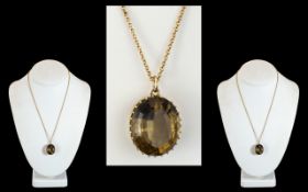 A Large 9ct Gold Smoky Topaz Set Pendant with Attached 9ct Gold Chain. Both Marked for 9.375. The