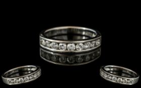 18ct White Gold Diamond Half Eternity Ring, channel set with nine brilliant cut diamonds. Weight .75