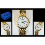 18ct Gold Ladies Tissot Wrist Watch, white enamel dial with baton numerals with 18ct gold integral
