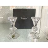 A Pair of Waterford Crystal Candlesticks, in original box, measure 5'' high.